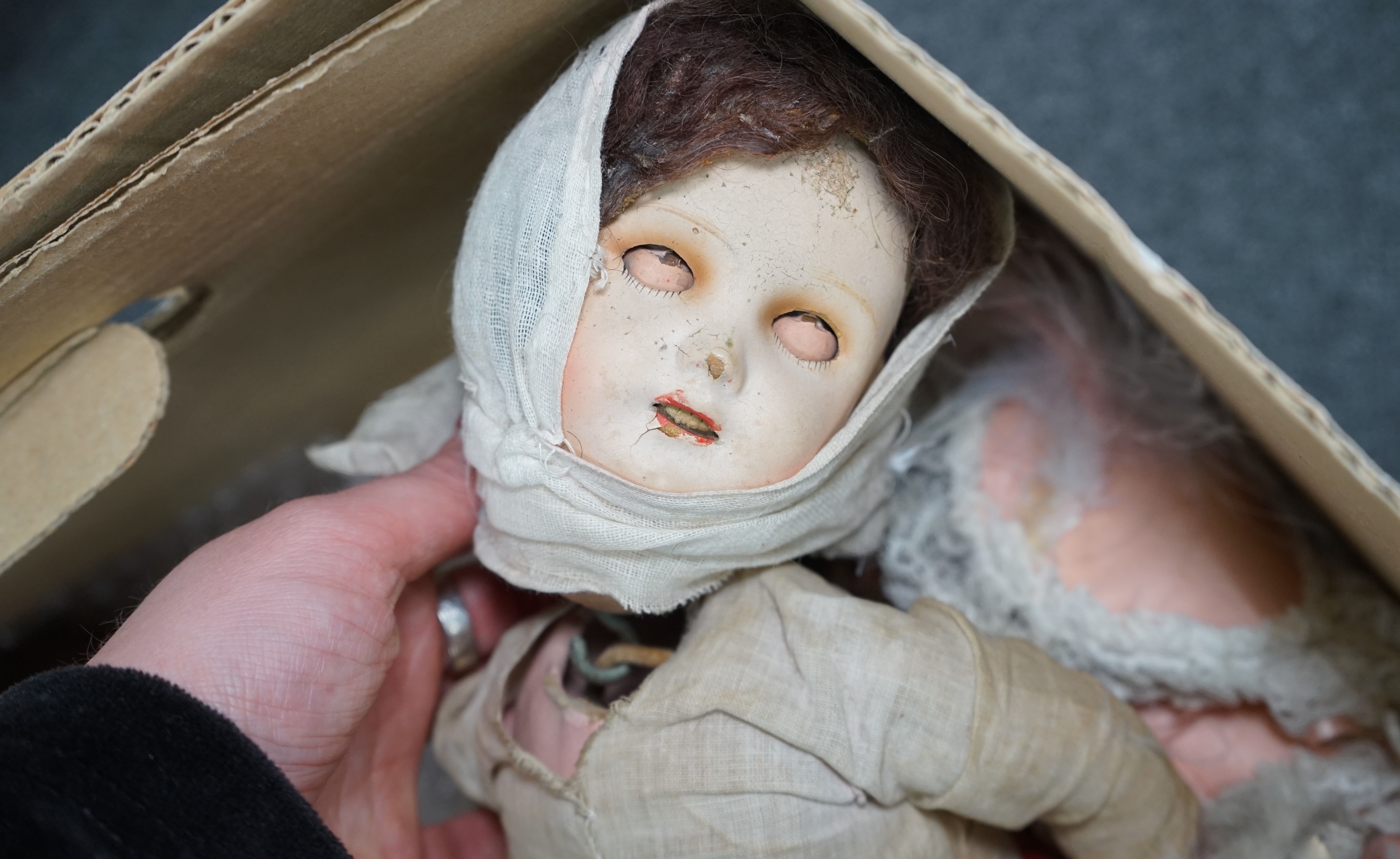 An Armand Marseille bisque doll, mould 390, a small Hermann Steiner bisque doll, three other bisque dolls including an SFBJ 60, and four composition dolls, Armand Marseille 33cm. Condition - poor to fair